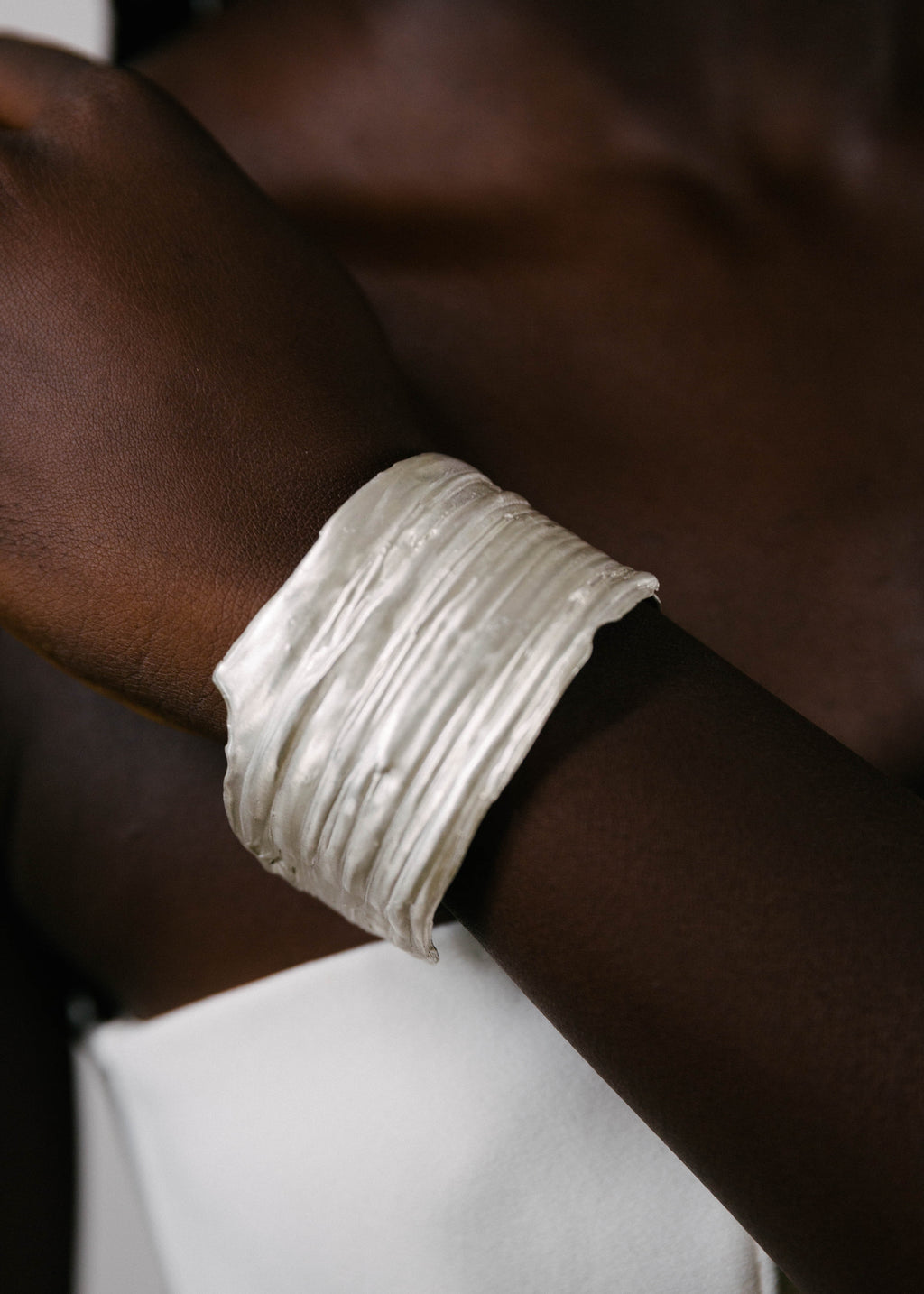 handcrafted silver bracelet worn by model