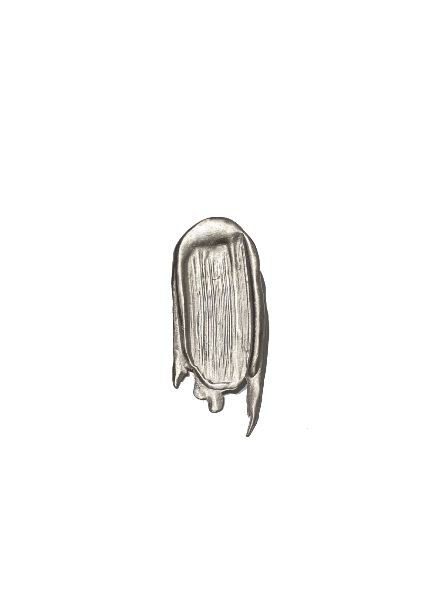 Handcrafted brooch in silver looking like a paint stroke on white background