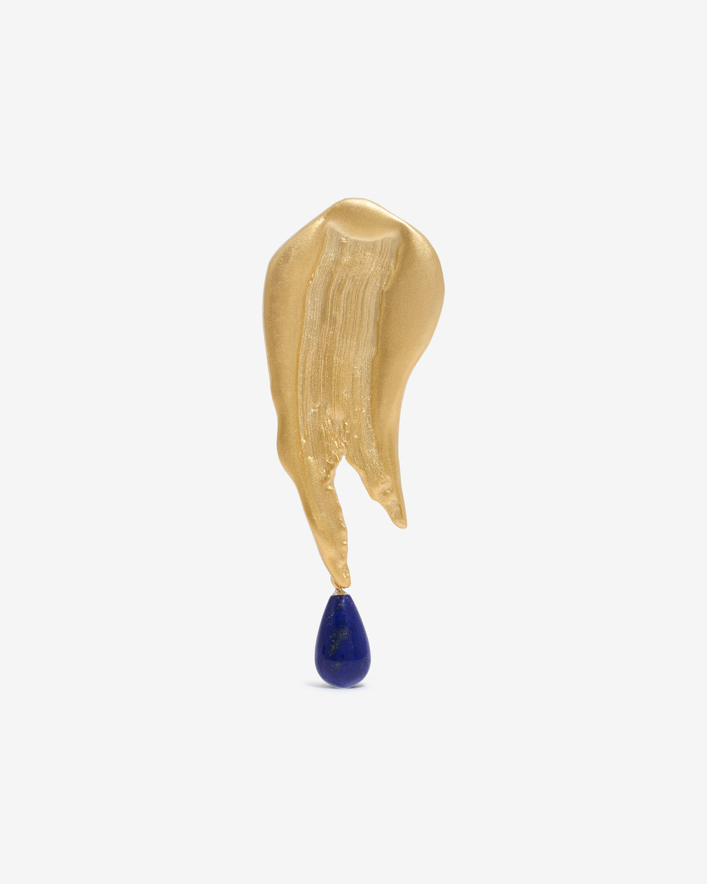 Handcrfated gold brooch with a blue gemstone hanging from the bottom on a white background