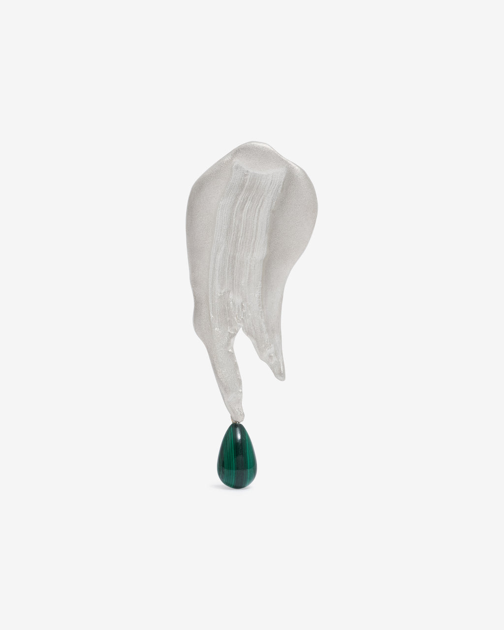 Handcrafted silver brooch with a green gemstone hanging from the bottom on a white background