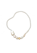 Handcrafted pearl necklace on white background with gold details