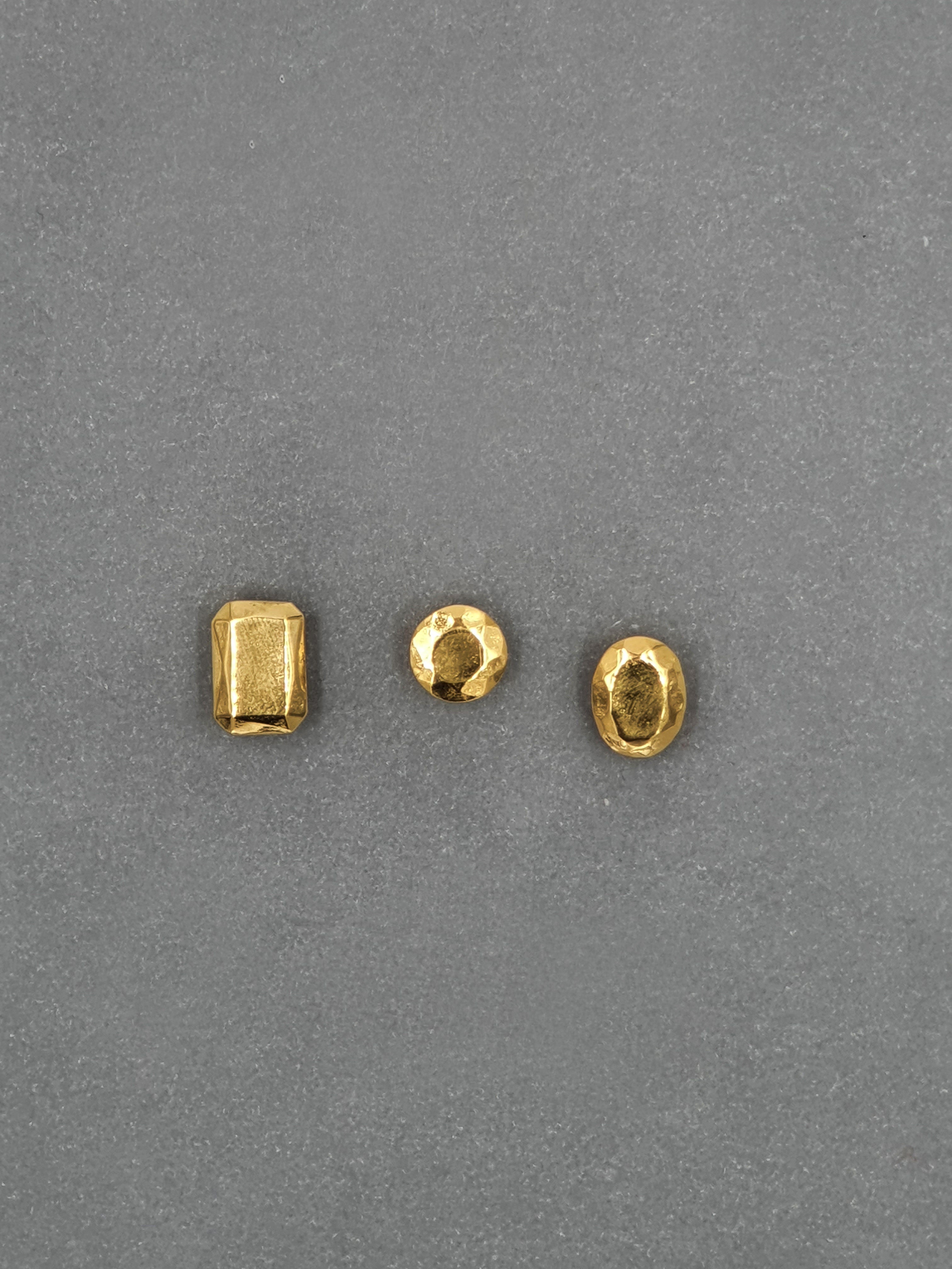 Handcrafted gold pendants in different gemstone shapes