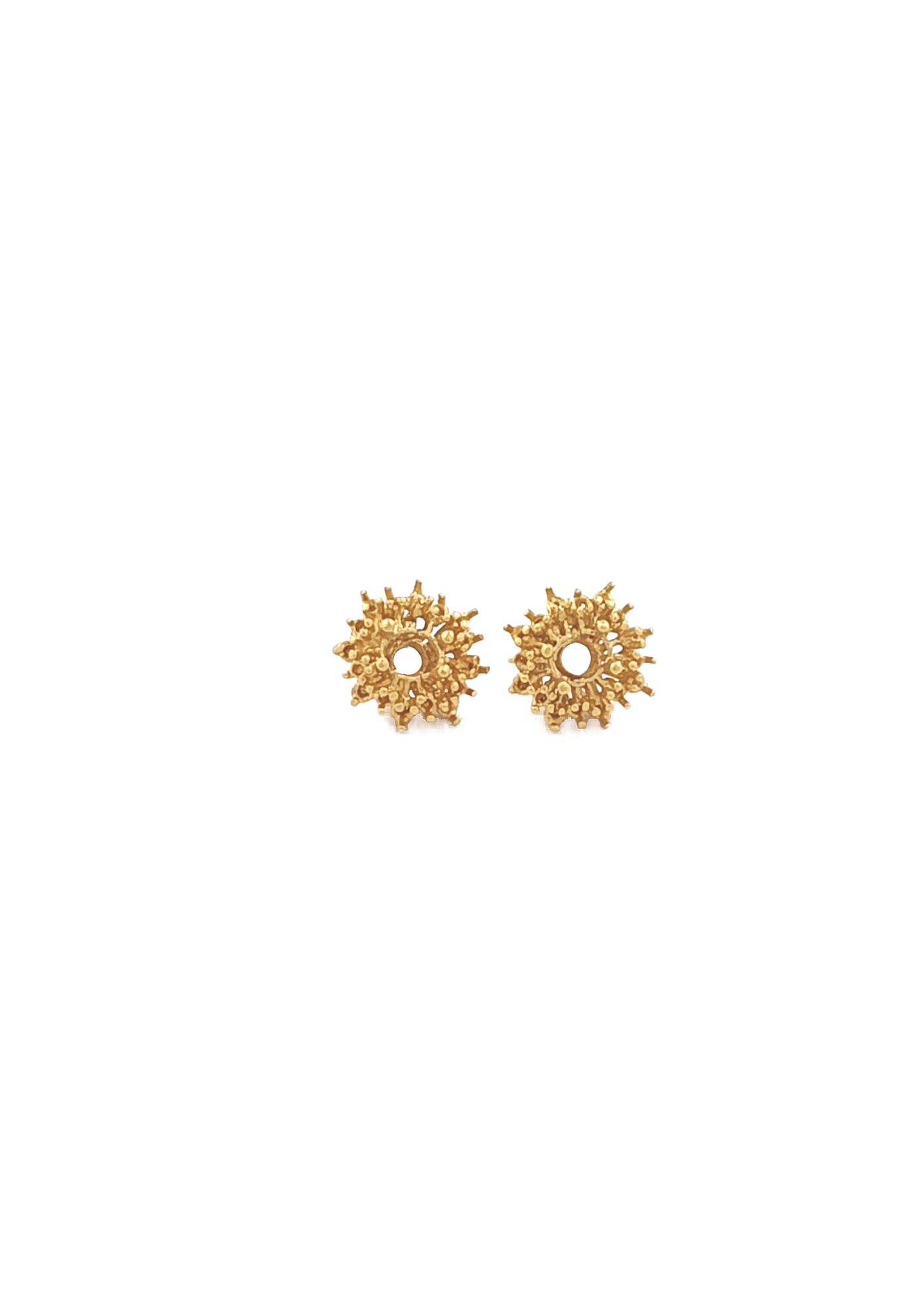 handcrafted gold earring studs on white background