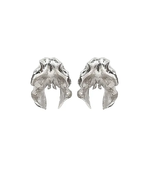 Pair of handcrafted silver orchid-shaped earrings on a white background